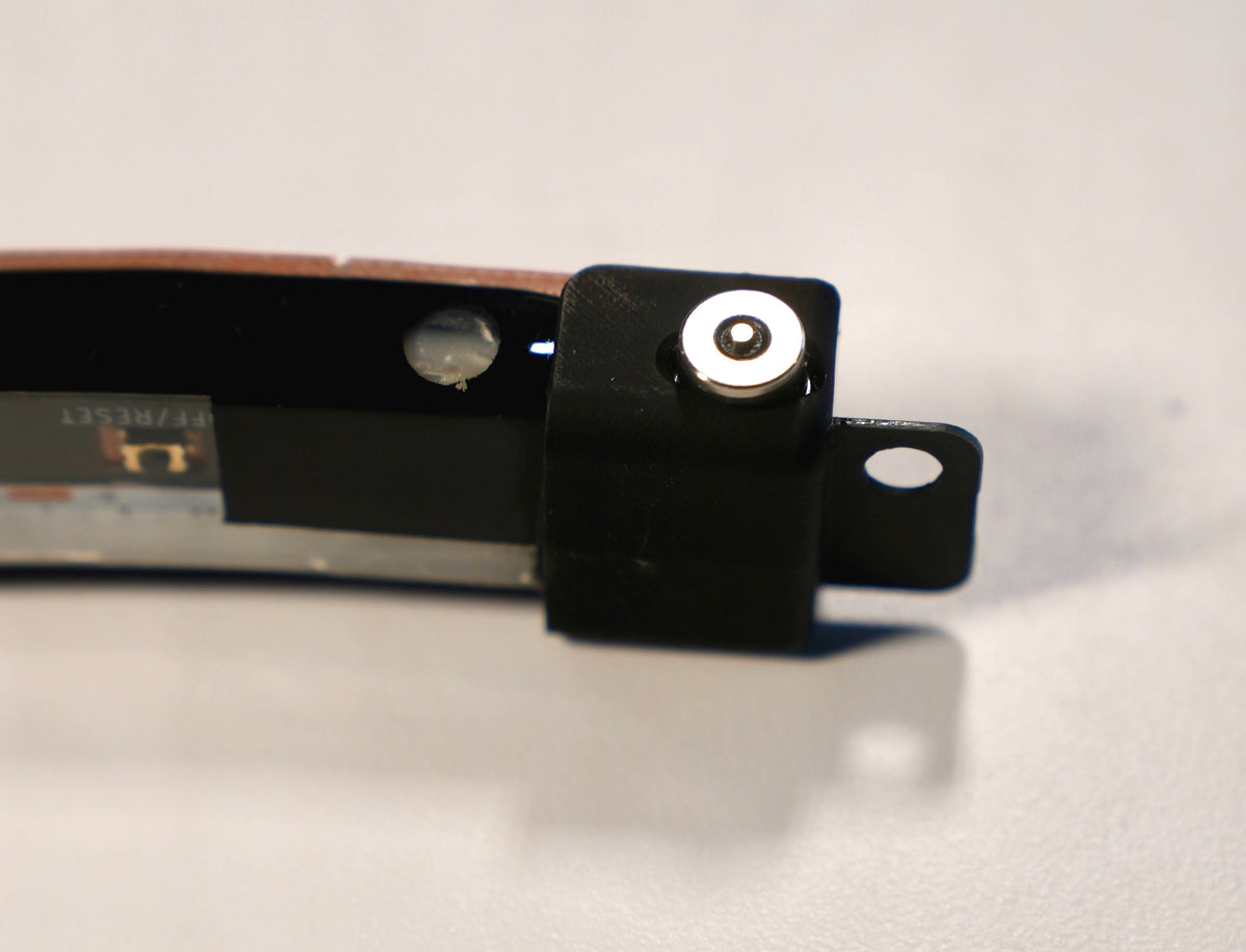 Close-up of a USB port on Nyxglo motorcycle wheel light unit on a white background