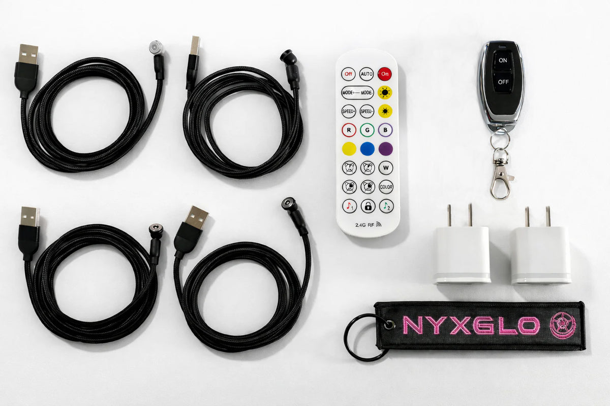 Collection of electronic accessories including USB cables, a remote control, and a power adapter on a white background.
