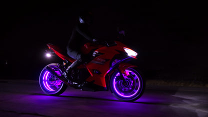Motorcycle with purple wheels on a dark background